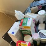 bedside table full of medications taken during COVID illness