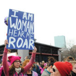I am woman hear me roar sign at Boston Women's March 2017